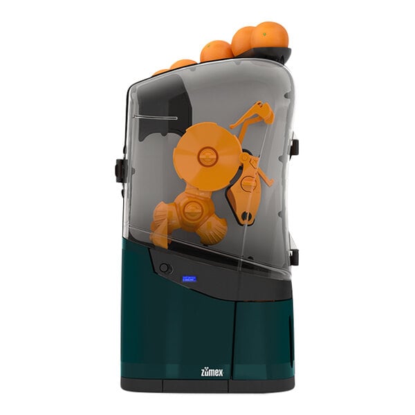 A Zumex commercial orange juicer with oranges in it.