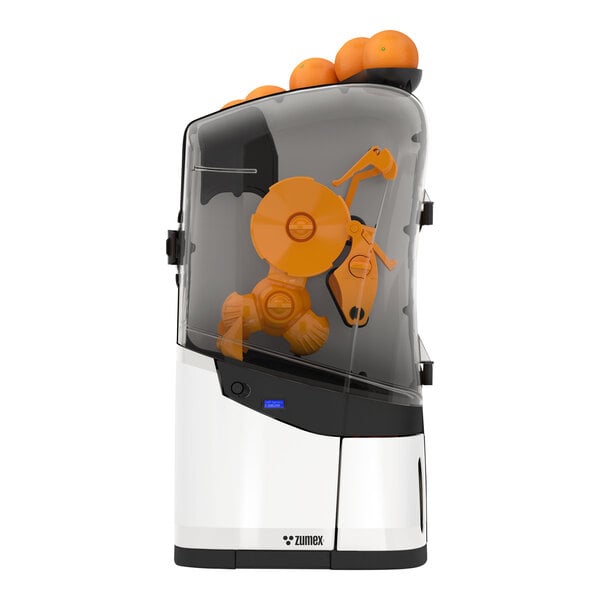 A white Zumex Minex commercial juicer with oranges inside.