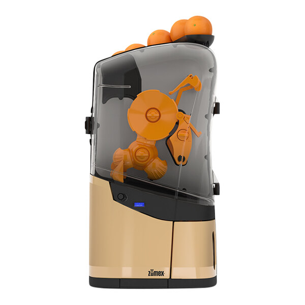 A Zumex Minex commercial juicer with oranges in it.