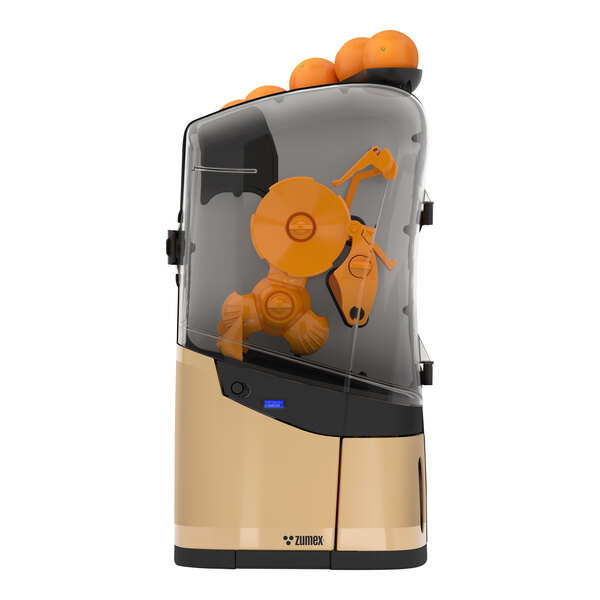 A Zumex Minex commercial orange juicer with oranges in the front.