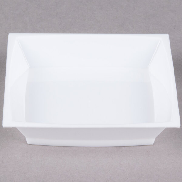 A close-up of a white WNA Comet square dish.