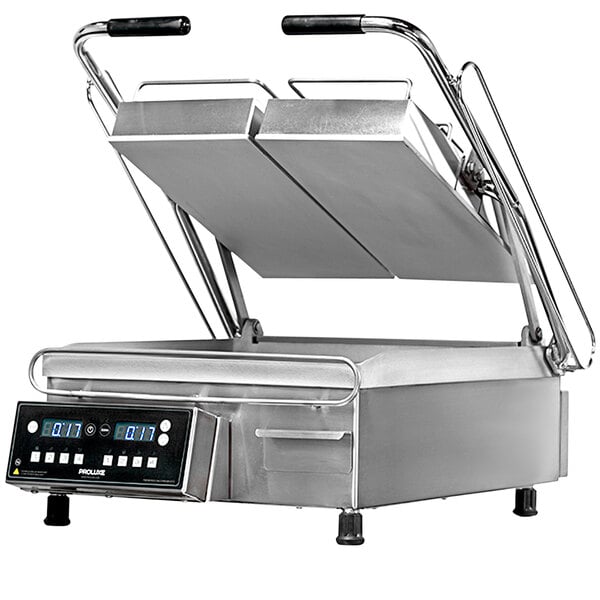 A Proluxe Vantage split lid panini grill on a counter with smooth plates.