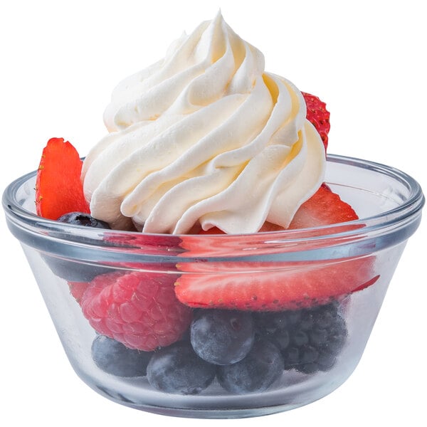 A bowl of fruit with Rich's Sugar-Free Whipped Dessert Topping.