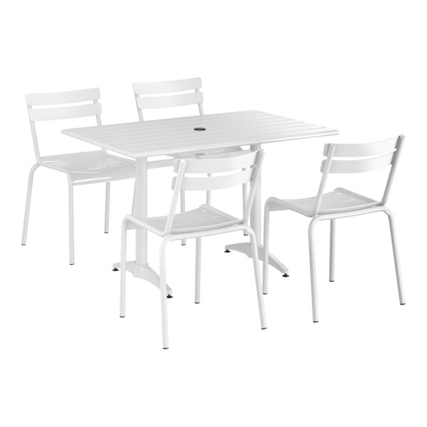A white Lancaster Table & Seating outdoor table with 4 chairs.