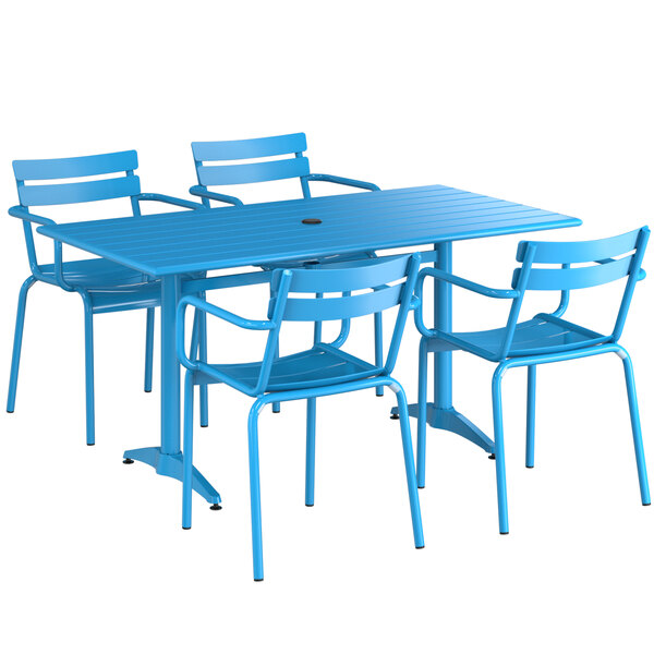 A blue Lancaster Table & Seating outdoor table and chairs.