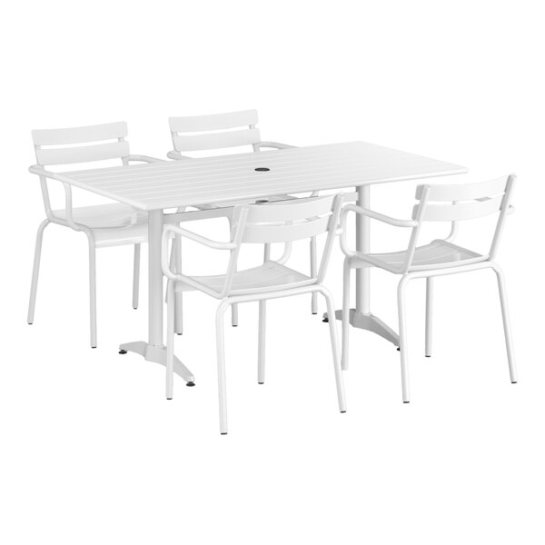 A white Lancaster Table & Seating outdoor table with chairs and an umbrella.