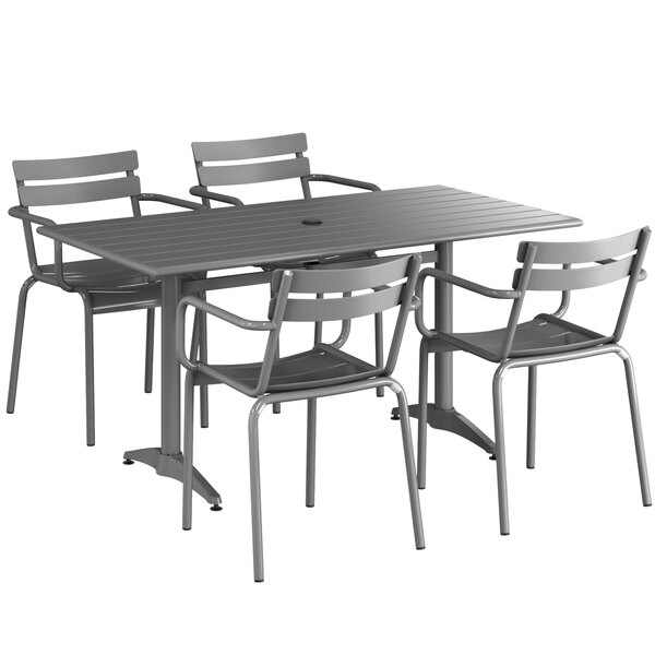 A Lancaster Table & Seating matte gray outdoor dining set with four chairs on a patio.