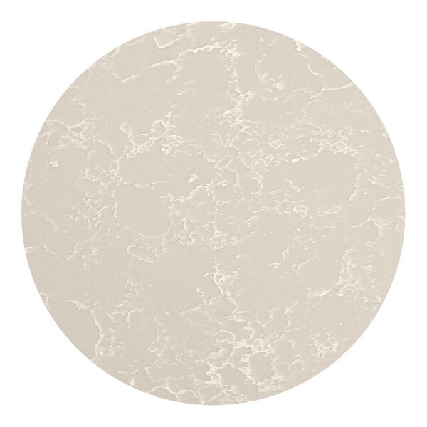 A white circular quartz tabletop with gray veining.