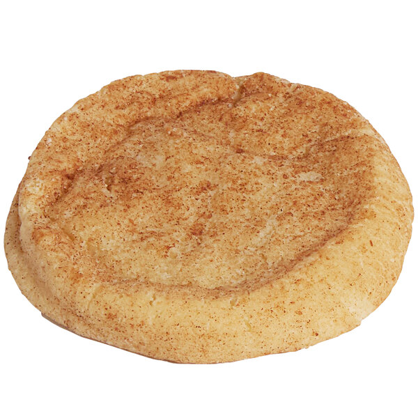 A close up of a brown speckled Christie Cookie Co. Snickerdoodle cookie.