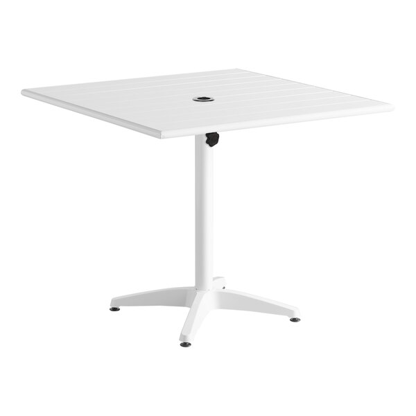 A white square Lancaster Table & Seating outdoor table with a white metal base.