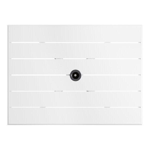 A white Lancaster Table & Seating outdoor table with a black umbrella hole.