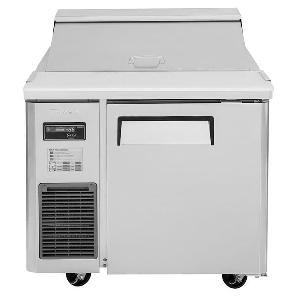 A white Turbo Air refrigerator with a door open.