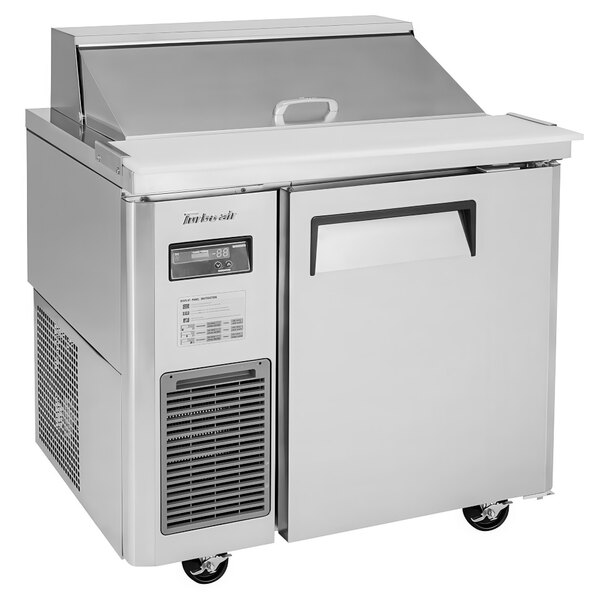 A Turbo Air commercial refrigerated sandwich prep table on wheels.