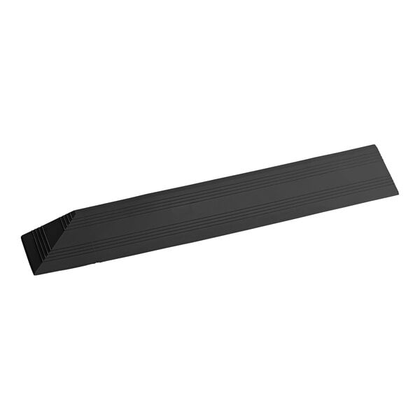 A black rectangular vinyl corner ramp with lines on it.