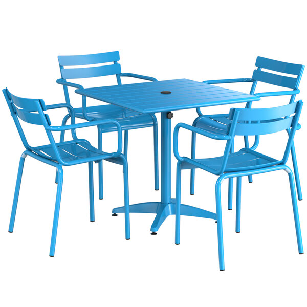 A blue powder-coated aluminum table with four chairs surrounding it.