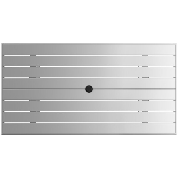 A white rectangular outdoor table with a black circle.