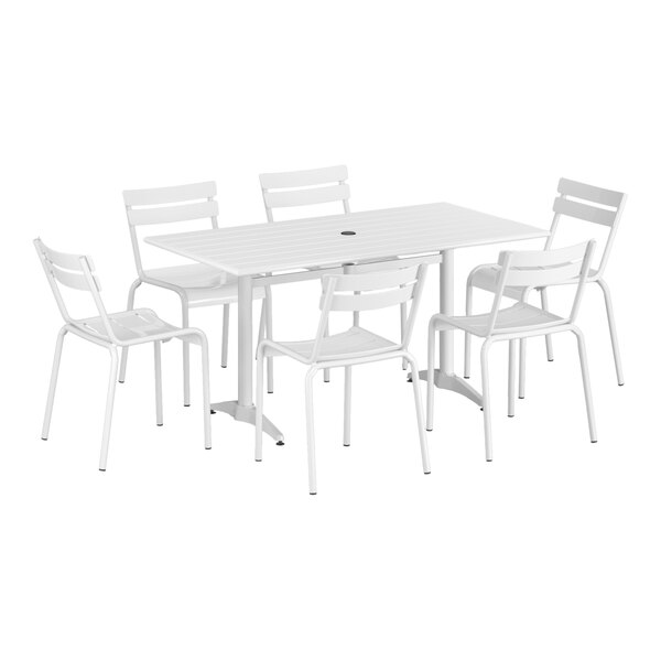 A white Lancaster Table & Seating dining table and six chairs.