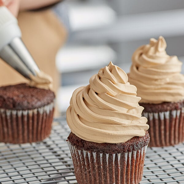 a chocolate cupcake with a frosting on top