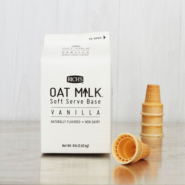 A white carton of Rich's Plant-Based Vanilla Oat Milk Soft Serve Base.