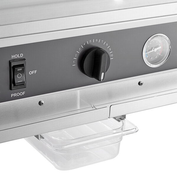 A ServIt stainless steel half size insulated holding cabinet with a solid door on a counter in a professional kitchen.