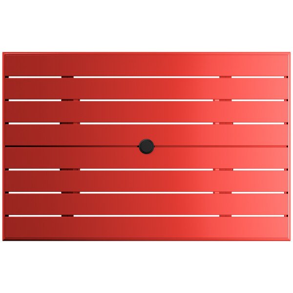 A red rectangular Lancaster Table & Seating outdoor table with a black umbrella hole.