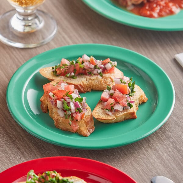 A red Acopa Foundations melamine plate with salsa and tomato on toasted bread.