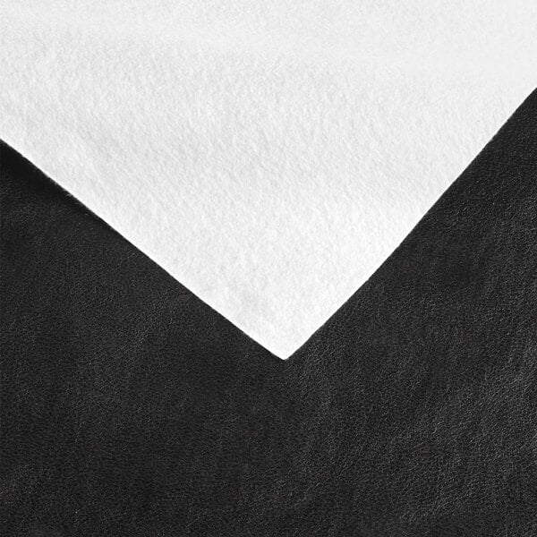 A white and black vinyl table cover with a black surface.