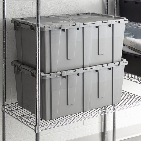 A stack of Lavex gray plastic flip-lid totes.