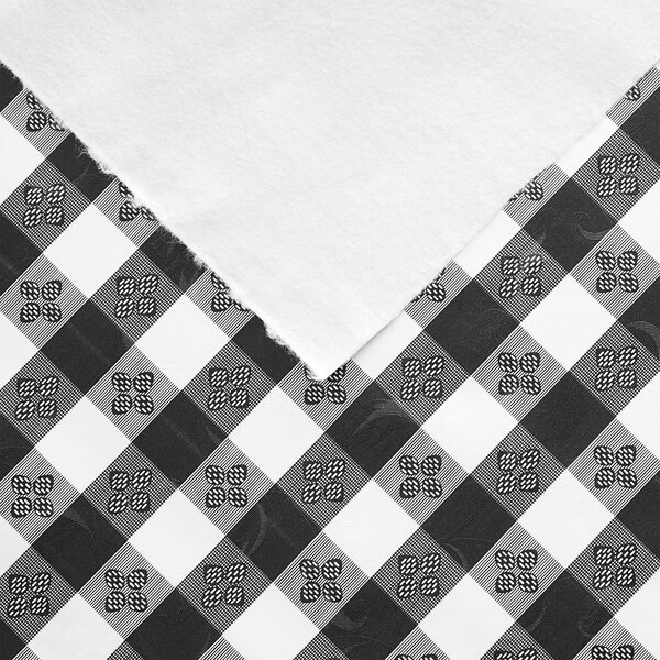 A 52" wide black and white checkered vinyl table cover with flannel back.