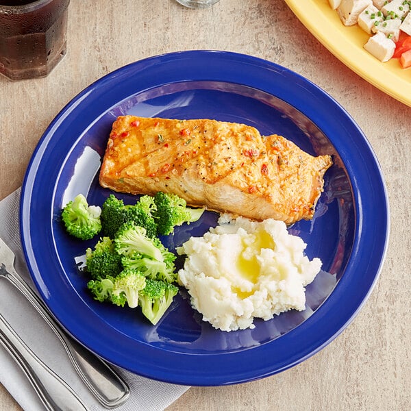 A blue Acopa Foundations melamine plate with fish, broccoli, and mashed potatoes.