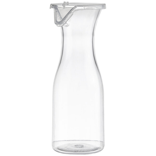 A clear plastic pitcher with a handle.