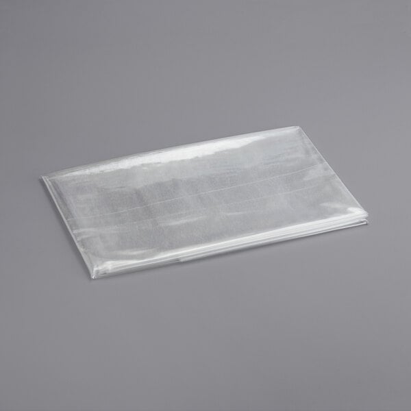 A clear plastic bag on a gray surface.