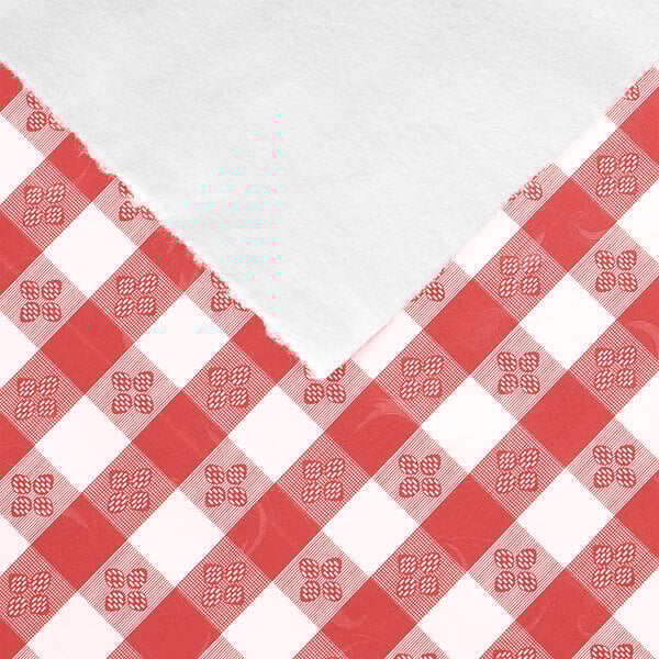 A roll of red and white checkered gingham vinyl table cover with flannel back.