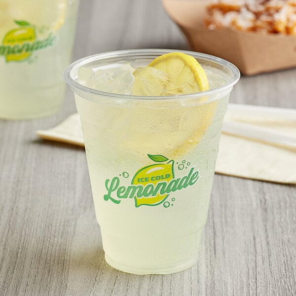 A cup of Carnival King lemonade with a lemon slice on the rim.