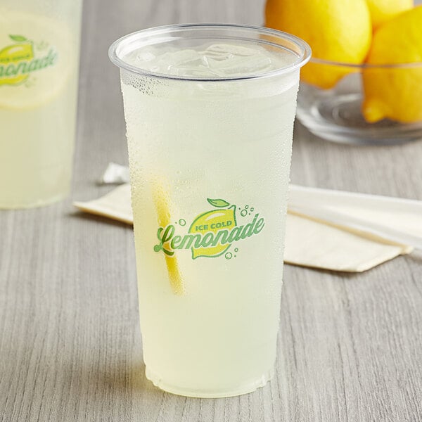 Two Carnival King clear plastic lemonade cups filled with lemonade and straws.