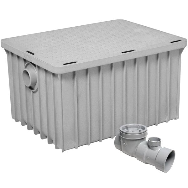 A grey plastic Endura grease trap with a pipe.