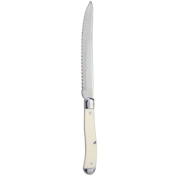 A Walco stainless steel steak knife with a white Delrin handle.