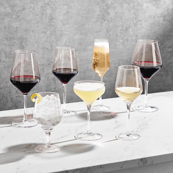 A group of Della Luce Astro coupe glasses on a table.