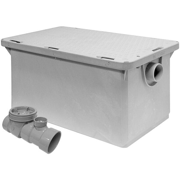 A white plastic Endura grease trap box with a drain and pipe.