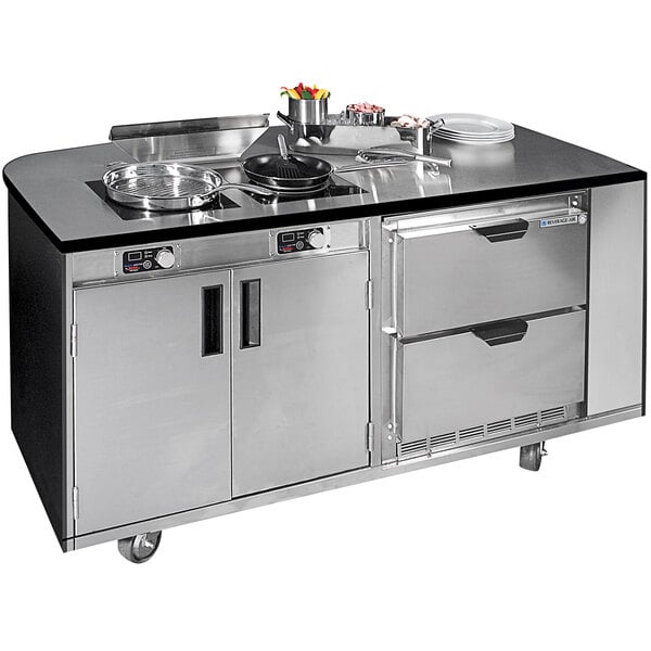 A large stainless steel Spring USA culinary station with a stove and sink on a counter.