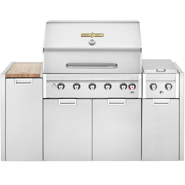 A stainless steel Crown Verity natural gas barbecue grill with a white cover.