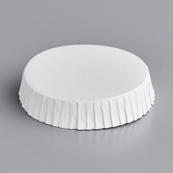 A white paper wrapper on a 2 1/2" white disposable carafe cover.