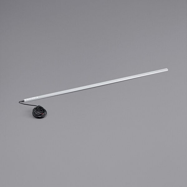 An Avantco LED light with a white tube and black wire.