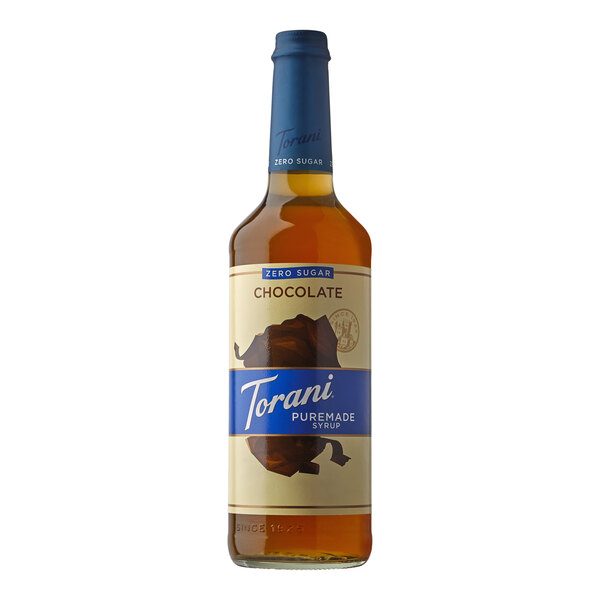 A Torani Puremade chocolate syrup in a glass bottle with a blue label.