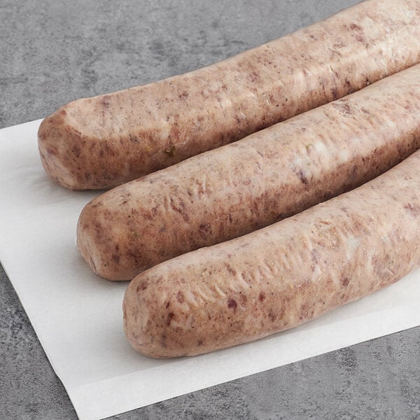 Warrington Farm Meats Sweet Italian Sausage Links on a white surface.