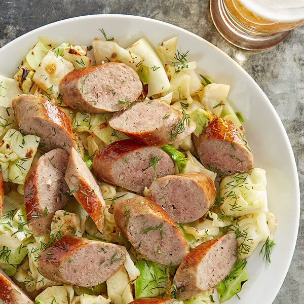 A plate of food with Warrington Farm Meats Kielbasa Sausage Links and cabbage.