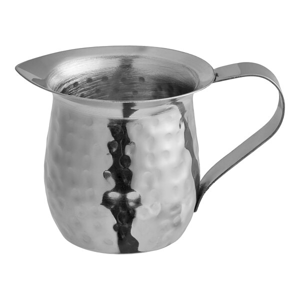 A Vollrath stainless steel bell creamer with a handle.