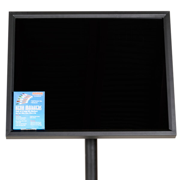 A black board with a white border on a black stand.