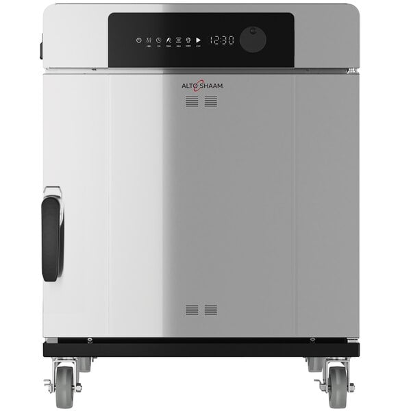 A large stainless steel Alto-Shaam cook and hold smoker oven with wheels.