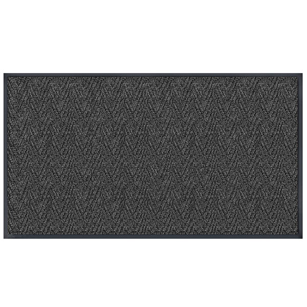 A rectangular charcoal grey Lavex entrance mat with a chevron pattern.